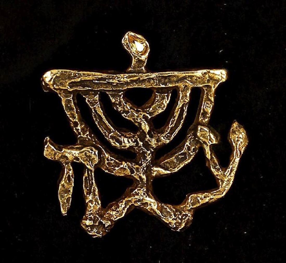 Jacques Lipchitz 1891-1973 (French): **Jacques Lipchitz 1891-1973 (French) Menorah brooch gold plated brass with stone, limited edition 4.70 x 5 cm (2 x 2 in.) initialled lower right, signed on the reverse Provenance: Jewish Museum colle