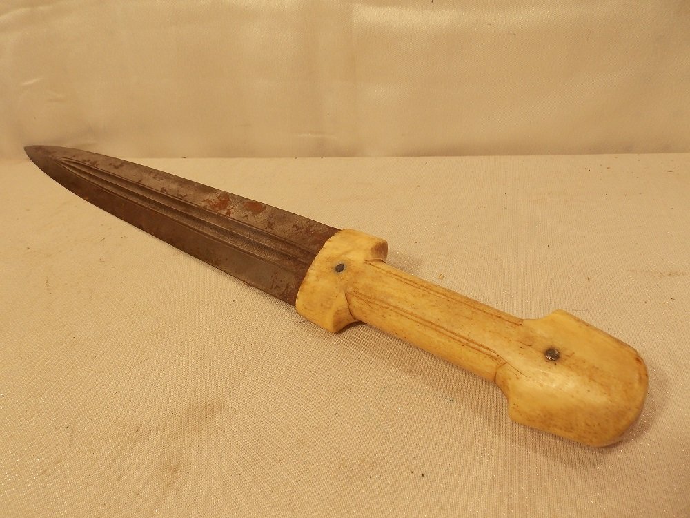 RUSSIAN KINDJAL KNIFE WITH TUSK HANDLE: Antique Russian Kindjal large dagger with 15â€ long blade with blood grooves and walrus tusk carved handle. 20.5 long, blade is 15â€ long. Some rust.