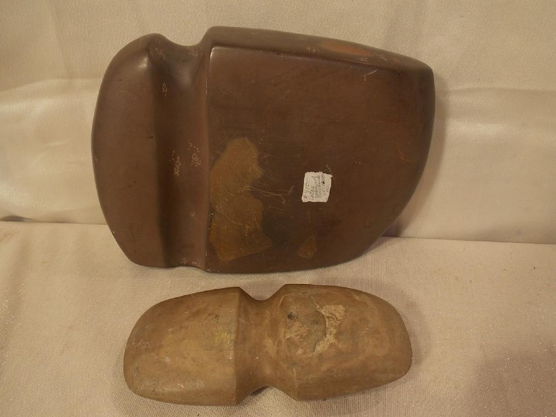 2 ANTIQUE TOMAHAWK STONE AXES: A large ceremonial stone tomahawk ax head, labled St. Charley MO (9 in x 7 in) together with another tomahawk stone ax head, 6.5 x 3.5 inches.