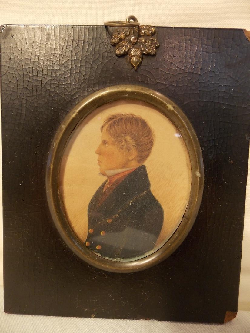 CA 1820 MINIATURE PORTRAIT GENTLEMAN: Antique miniature oval portrait painting of a gentleman, unsigned. 3 x 2.25 inches. In paper mache and ebony frame.