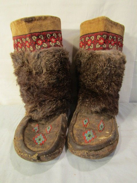 PAIR BEADED LEATHER INDIAN BOOTS: Pair antique Eskimo or Northwest Indian leather & fur boots with beadwork. 12 in long.