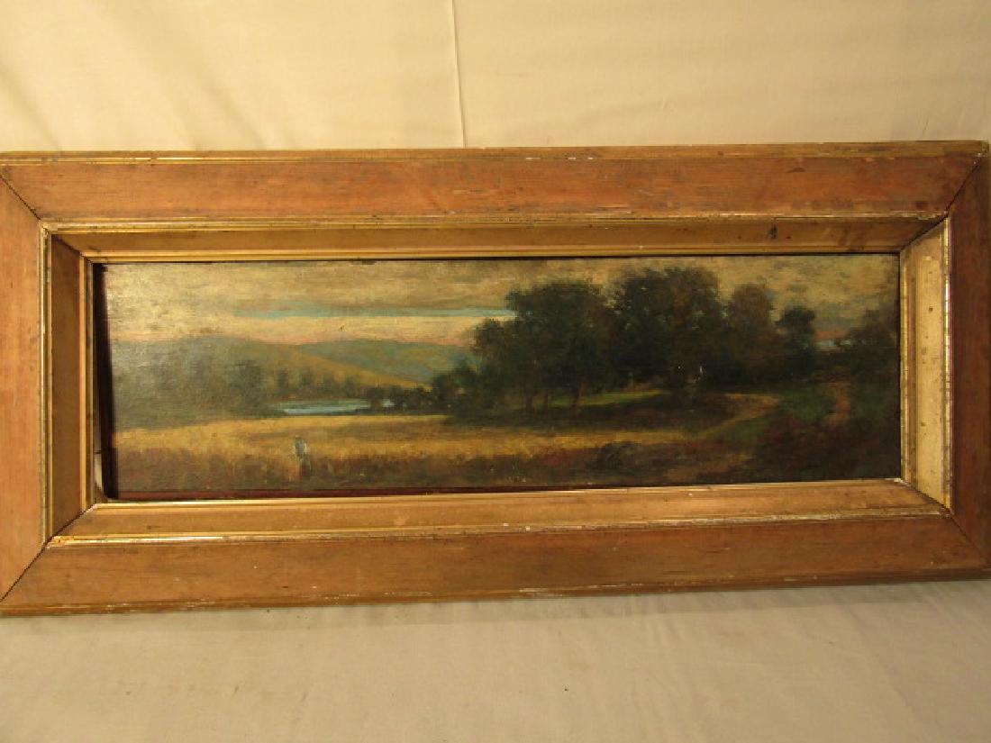 ANTIQUE LANDSCAPE PAINTING SIGNED EMB: Antique oil on wood panel of a man standing in field near mountain lake signed EMB. 7 x 24 in, framed 13 x 29. Needs cleaning, crack in panel.
