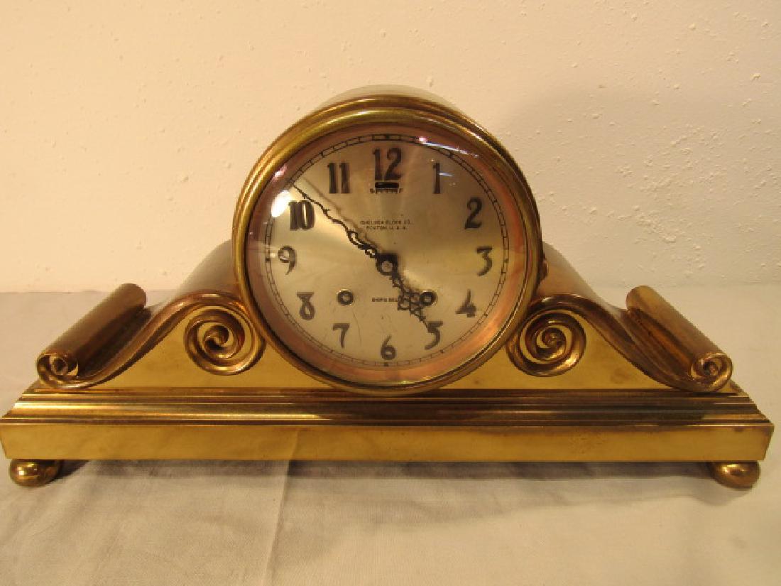 CHELSEA BRONZE SHIPS BELL CLOCK: Large bronze mantle clock with double scroll case, 5 in dial marked Chelsea Clock Co, Ships Bell, Boston USA. Movement pat. 1912. Size: 17 long x 8.5 high x 4.5 in deep. Clock runs but hands click on 