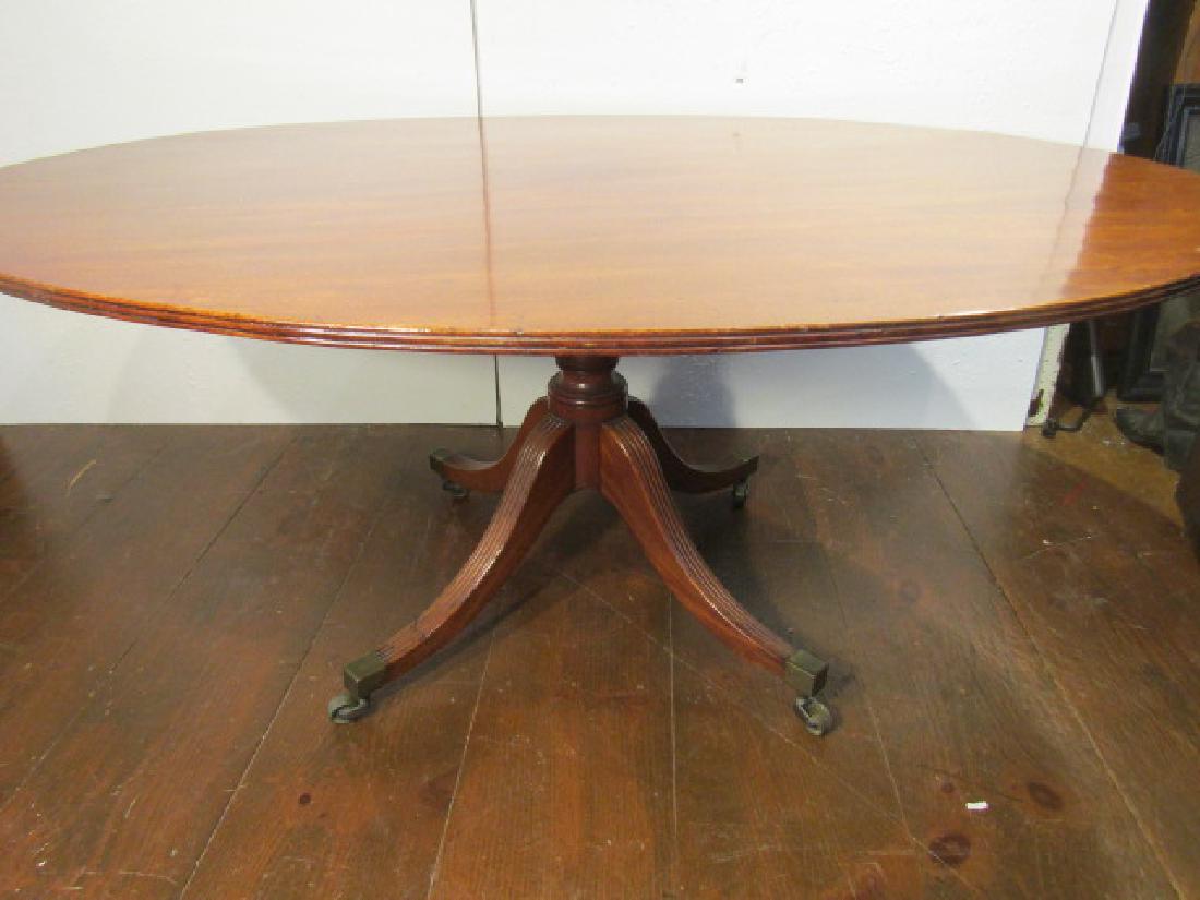 ANTIQUE DUNCAN PHYFE DINE TABLE: Circa 1820 Duncan Phyfe mahogany dining table (tilt top) with splayed legs. 65 long x 47 wide x 28 high. Good condition.