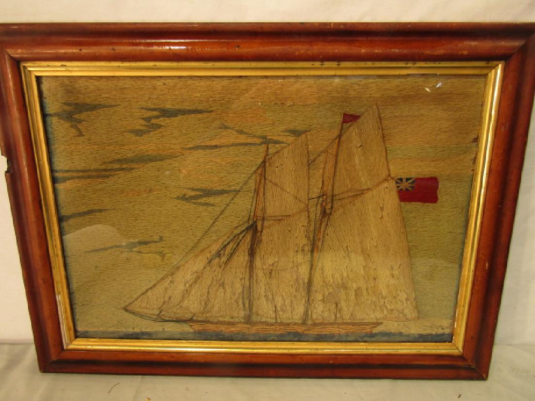ANTIQUE WOOLWORK YACHT PICTURE: Antique wool embroidered or "woolie" framed picture depicting a British yacht. 13 x 19.5 inches, in birds eye maple frame 17 x 24. Good condition with some insect damage.