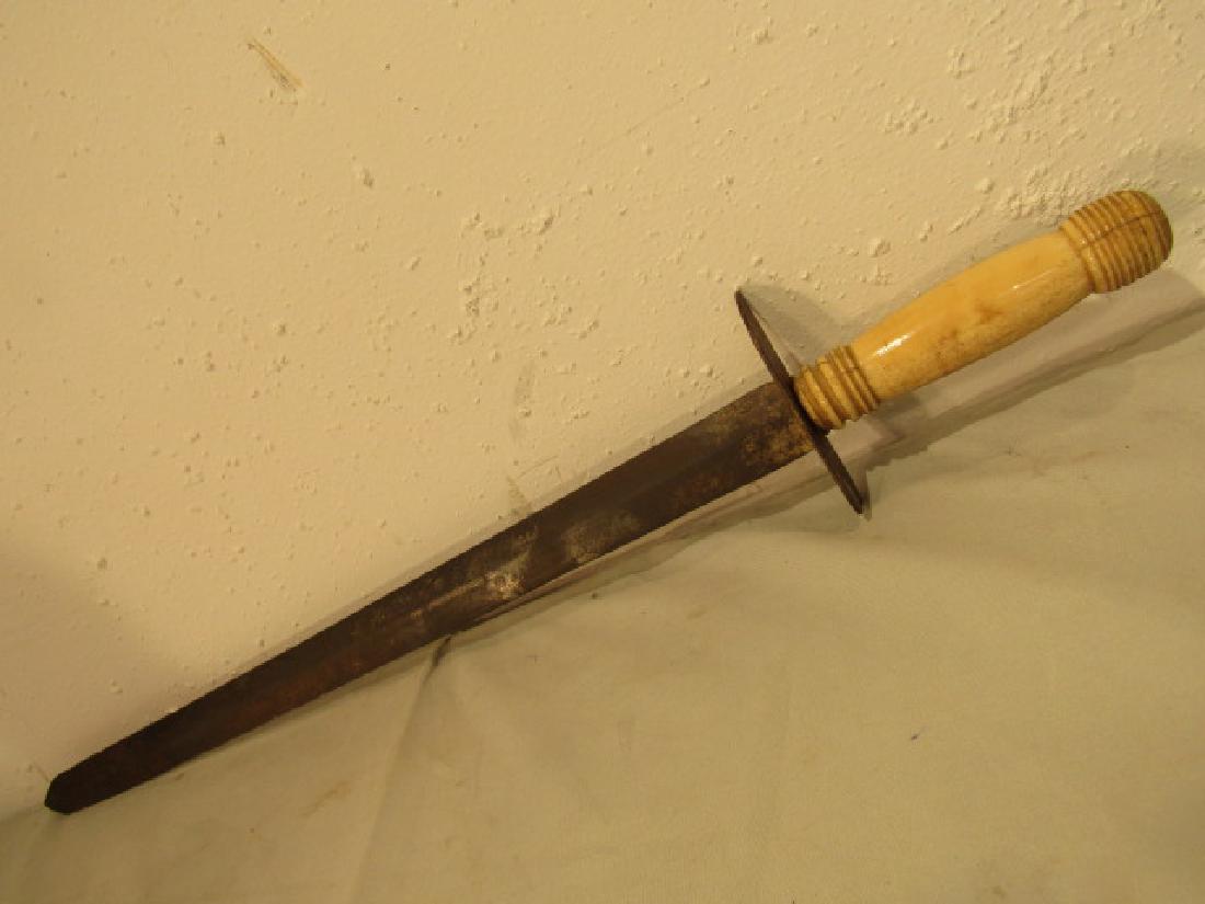 AMERICAN NAVAL SWORD CA 1800: Early 19th century American naval sword with carved and turned whale bone handle. 20 in blade, overall 25.5 inches.