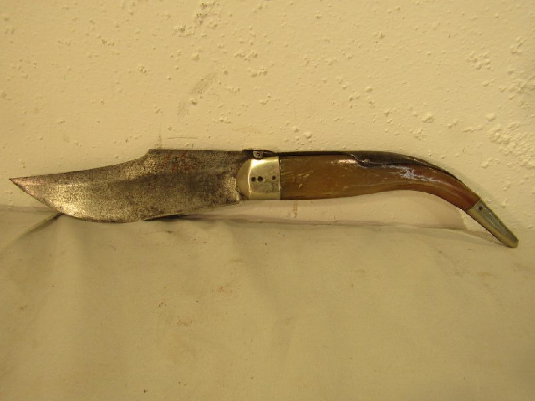 18TH C. FOLDING KNIFE: 18th century large folding knife with animal horn handle and clipped blade. 15 in long overall with 7 in blade.