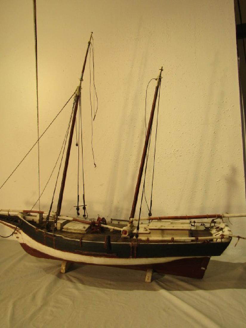 ANTIQUE MARYLAND SHIP MODEL: Circa 1900 painted wood scallop dragger model with name plaque OLEY CRISFIELD of Maryland. 55 in long x 46 high x 13 in wide. Good condition, no sails.