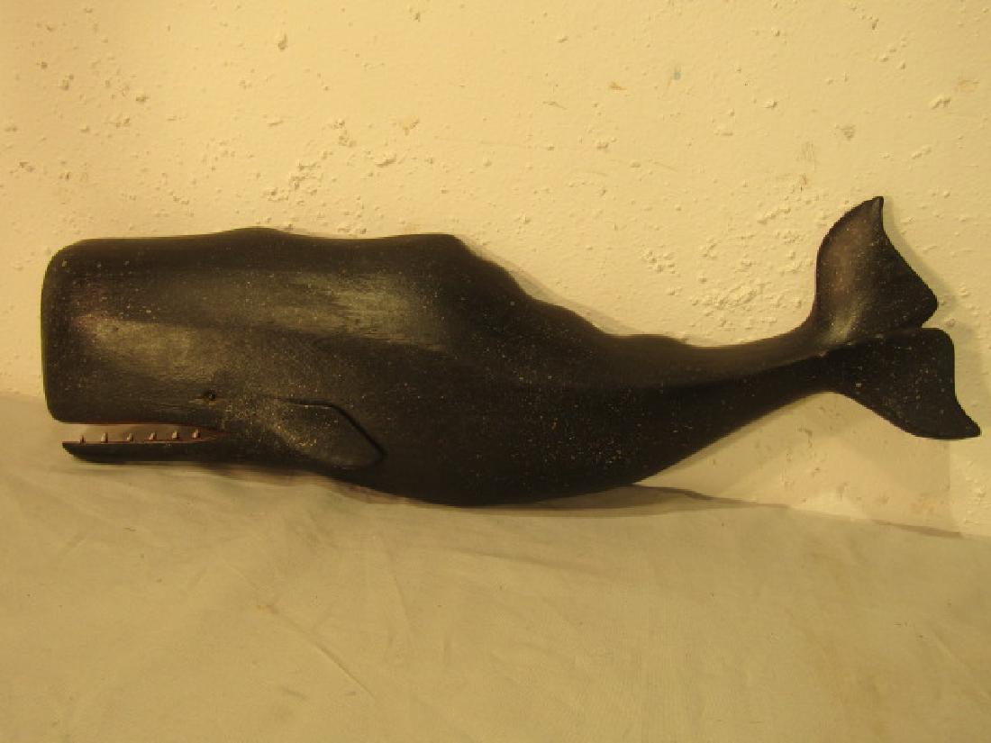 CARVED SPERM WHALE PLAQUE: Old carved and painted wood sperm whale plaque, unsigned in the manner of Clark Voorhees. Open mouth with teeth. 17.5 x 5.5 inches.