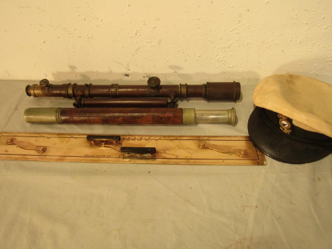 ASSORTED NAUTICAL LOT: Assorted group mostly instruments lot: Ross of London brass single draw telescope, 23 in; brass transit level, 22 in long (crack); Kelvin White parallel rule, 24 in; and a yacht hat size 7&1/8.
