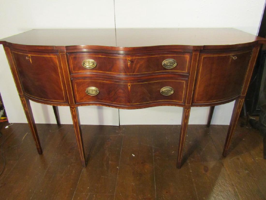 HENKEL HARRIS SIDEBOARD: Serpentine front inlaid mahogany Hepplewhite sideboard signed Henkel Harris Virginia Galleries. 67 long x 39 high x 27 deep. Few scratches on top.