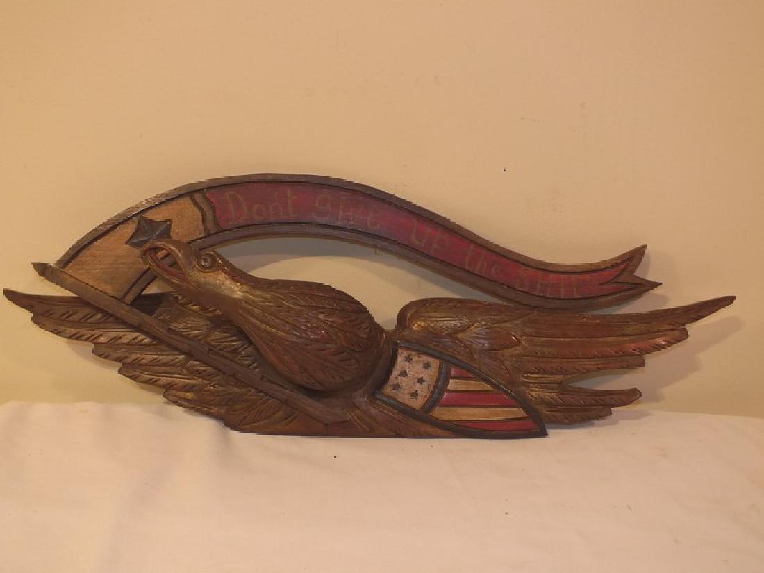 BELLAMY STYLE EAGLE & SHIELD PLAQUE: Bellamy style old carved wood eagle and shield plaque --Don’t Give Up The Ship. Partially painted, staple repair to wing. 28 x 10 inches.