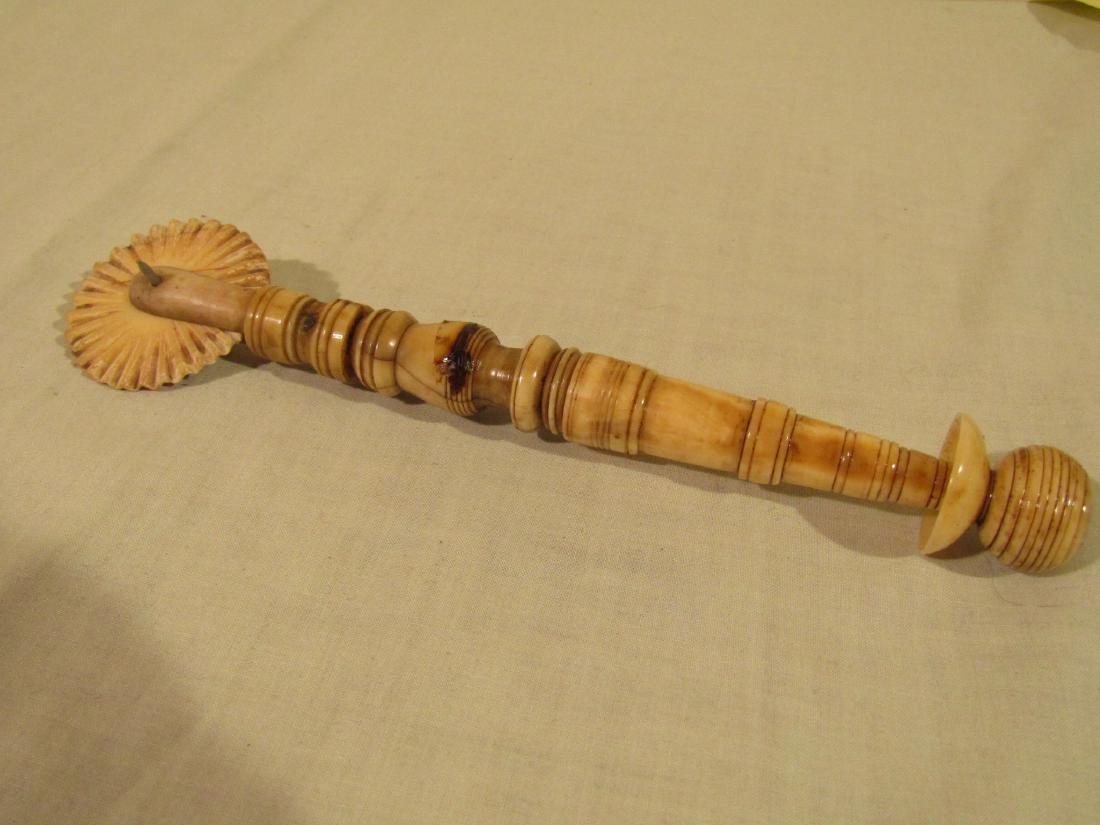 ANTIQUE WHALE BONE PIE CRIMPER: Antique whale bone 2 tone pie crimper, one end probably replaced. 7.5 inches long.