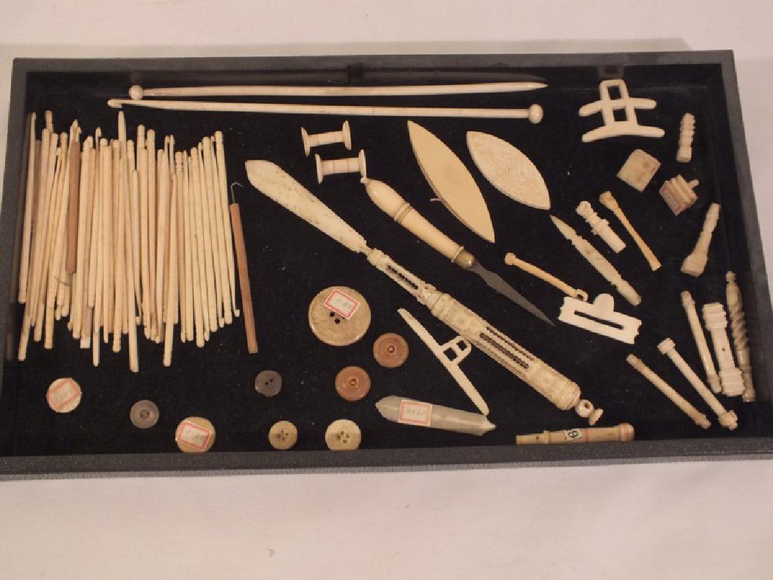 LOT SAILOR MADE BONE ITEMS: Sailor made bone items Includes many needles; buttons; rare carved pen and letter opener, 8.5 inches long; sewing implements; spools; bodkin; whimsies.
