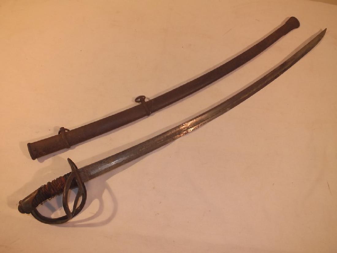 UNION CIVIL WAR CAVALRY SWORD: Union Civil War cavalry sword, Model 1850 with rusty scabbard, hallmarked 19. Size: 40.5 inches long, blade 35 inches.