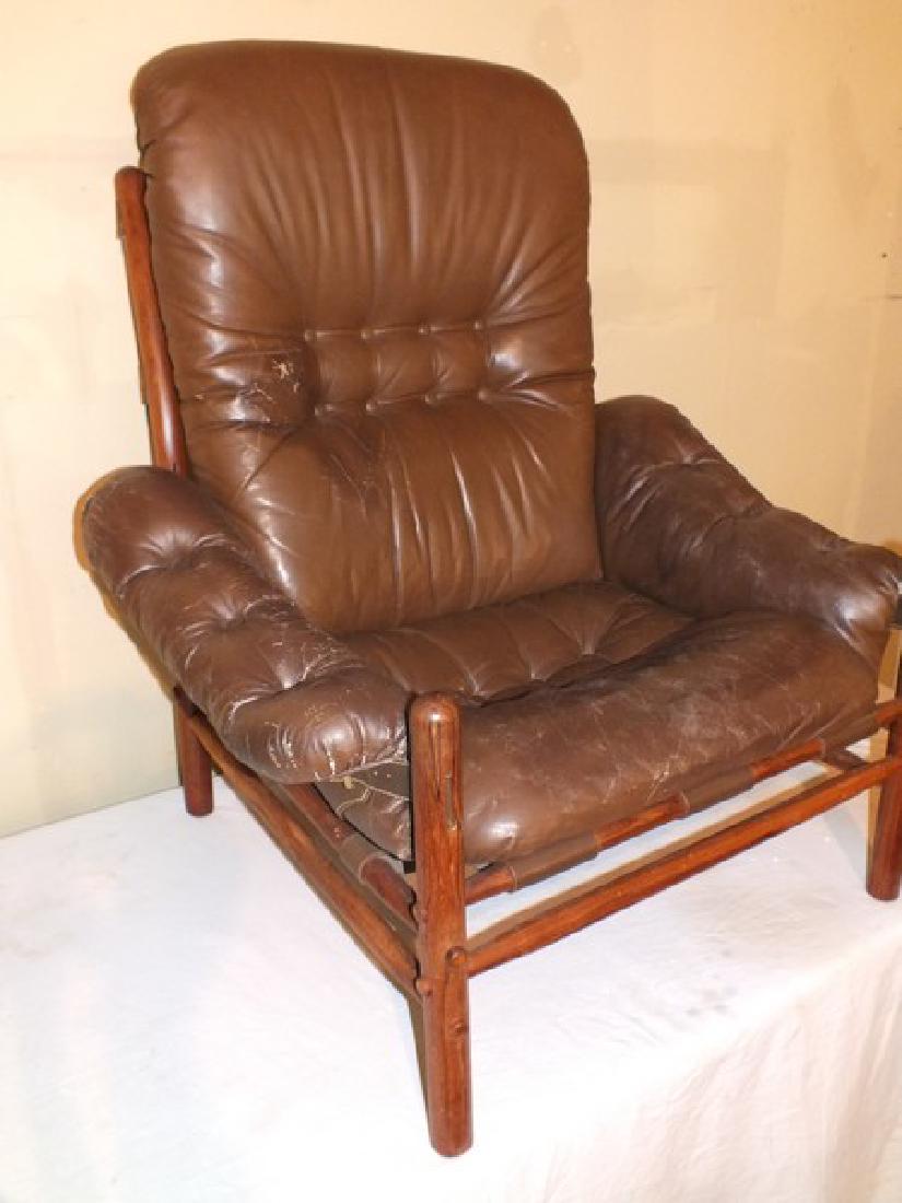 PAIR INCA LOUNGE CHAIRS & OTTOMAN - ARNE NORELL: Pair of Inca rosewood easy chairs with brown leather upholstery with a matching ottoman. Designed by Arne Norell. 40 high x 36 wide x 34 in deep, ottoman is 29 x 24 x 19 in high. All in good condition
