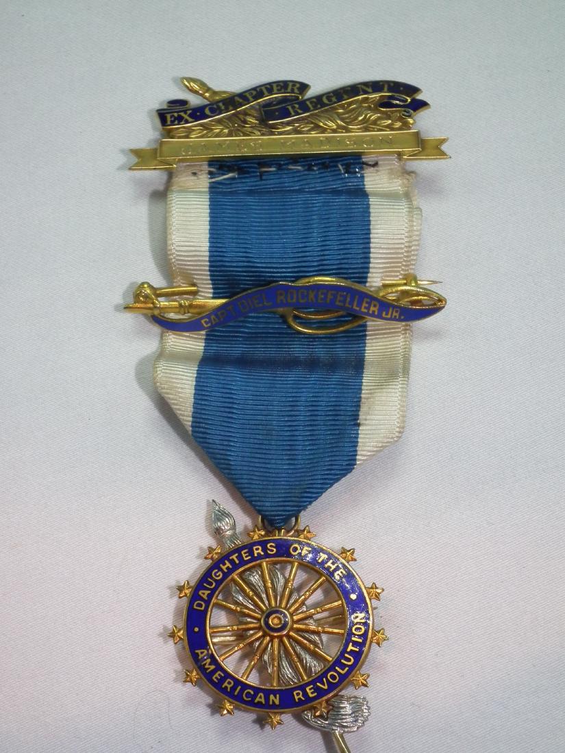 ROCKEFELLER GOLD DAR MEDAL: 14k gold Daughters of American Revolution medal with ribbon, stamped 14k JEC (Caldwell retailer), 4 in. long, 9.4 dwt. Engraved --Capt. Diel Rockefeller Jr, Ex Chapter Regent James Madison, Presented
