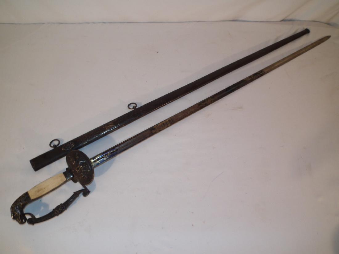 1830 US NAVAL OFFICERS SWORD: Circa 1815-40 American naval officer's sword with bone handle and eagle pommel with silver plated and engraved scabbard. Gilt designs and bluing on 32.75 in blade. 38 in long overall.