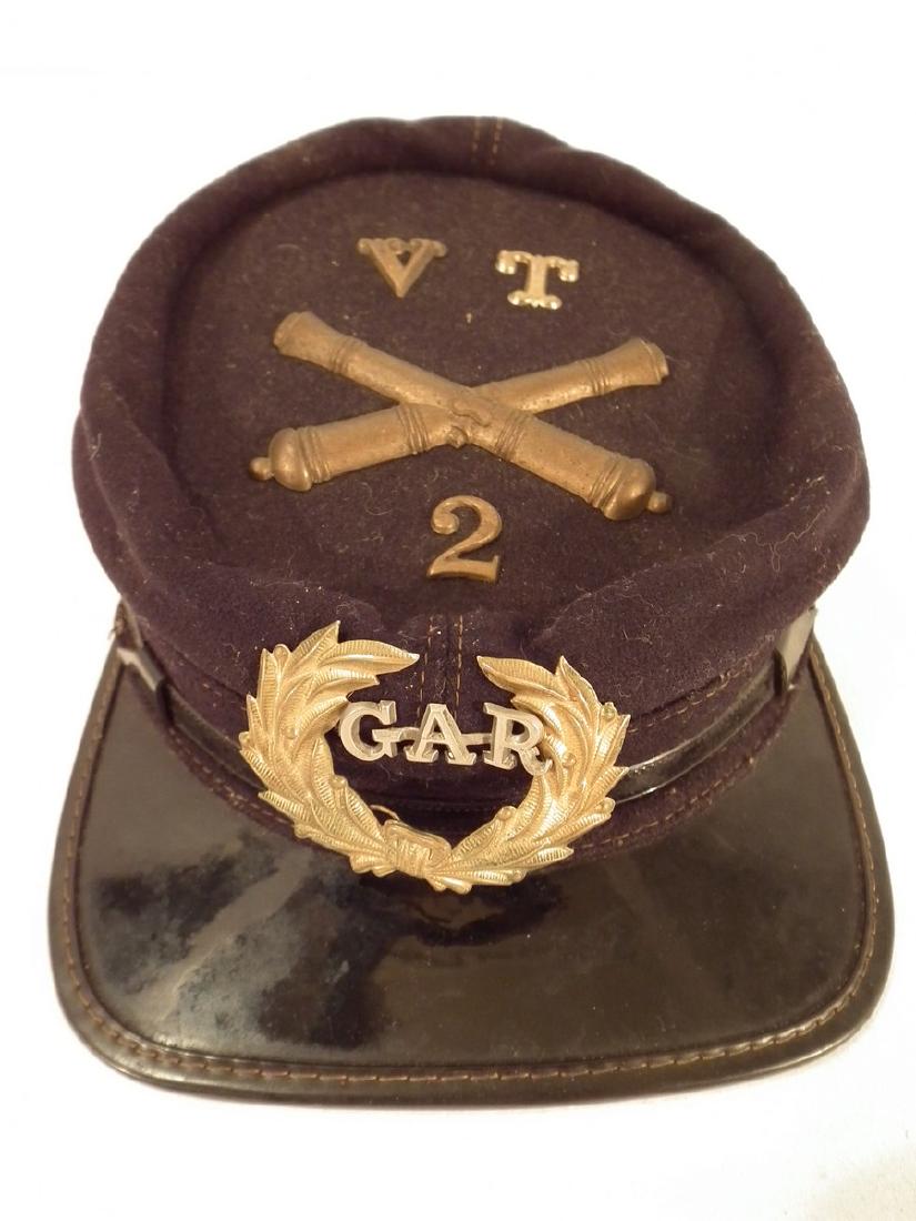 POST CIVIL WAR KEPI - EWELL OF VT GAR: Post Civil War Union kepi hat for VT GAR with brass cannons and number 2 unit - belonged to Clark Ewell, private, 2nd light battery artillery from Shaftsbury VT (was 1864-65 soldier). VG+ condition.