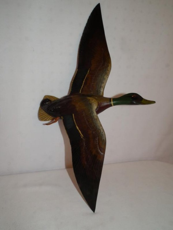 STARR MALLARD PLAQUE: A fine carved and painted wood flying mallard duck wall plaque from the Starr Collection. 21 x 12 inches high.