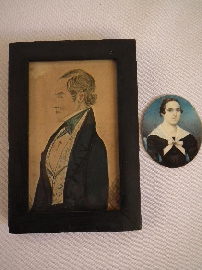 2 MINIATURE PORTRAITS: 2 antique miniature portraits including: oval of woman in black dress with pink bow, 2 x 1.5 inches; and circa 1830 watercolor painting of man in tuxedo mounted in ebony frame. Portrait is 4 x 2.25 in