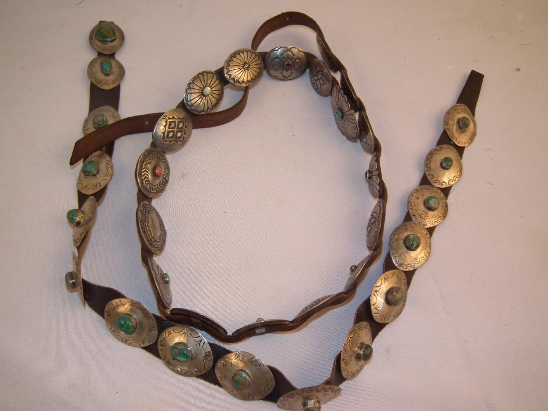 2 NAVAJO SILVER BELTS: Lot of 2 Southwestern /Native American gem set silver and leather belts including 42 in long with 18 oval silver medallions, 9 of which have gemstones; plus a 30 inch long belt with 16 silver medallio