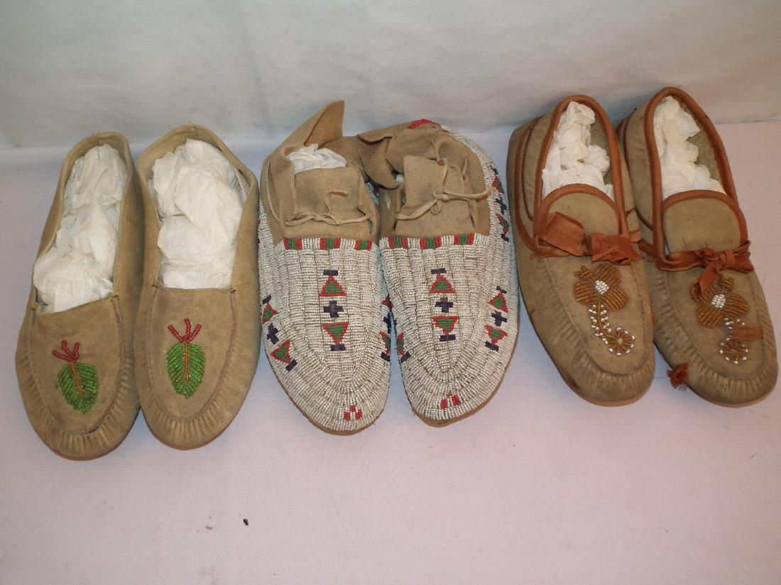3 PAIR INDIAN MOCCASINS: Lot of 3 pairs of old Native American leather moccasins with beaded designs to 10.5 inches long.