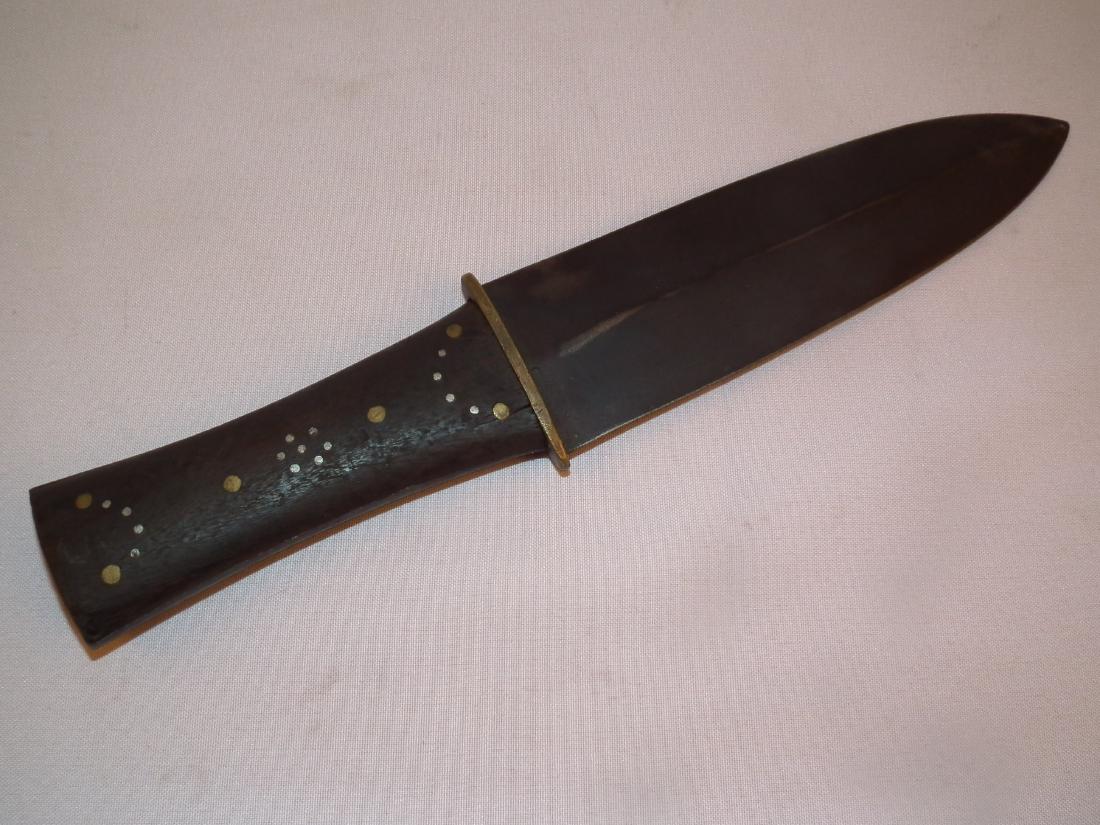 INDIAN DAG KNIFE: Old Native American dag knife with brass and silver studded wooden handle. Overall length 12.25 inches.