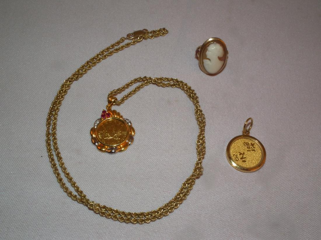 LOT GOLD JEWELRY: Includes 14k gold 24 inch long necklace with rubies and a 1993 $5 gold coin 1/10 oz; 10k gold Victorian cameo ring; 24k gold pendant with Chinese symbols, .75 inches. Total 13 dwt.