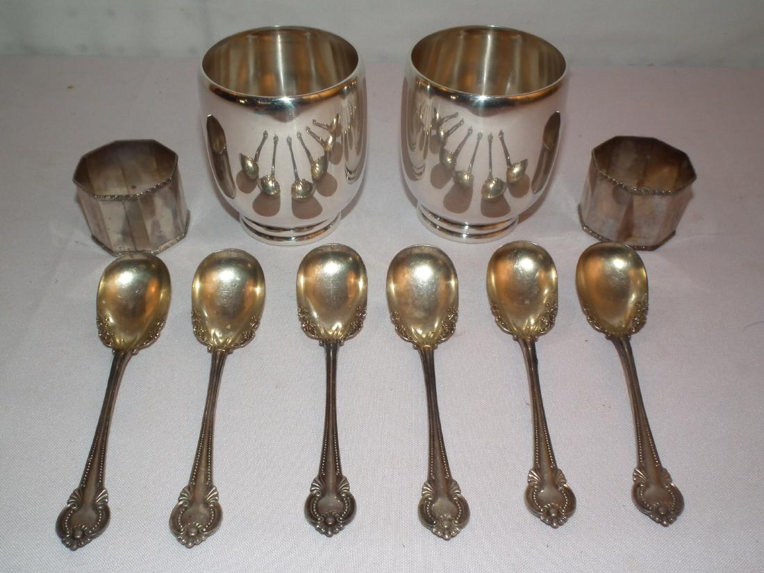 LOT STERLING CUPS ETC: Sterling silver lot consisting of pair of Kuala Lumpur 3.5 in tall cups; pair .800 napkin rings; American hallmarked spoons 5.32" long. Total weight 13.9 ozt.