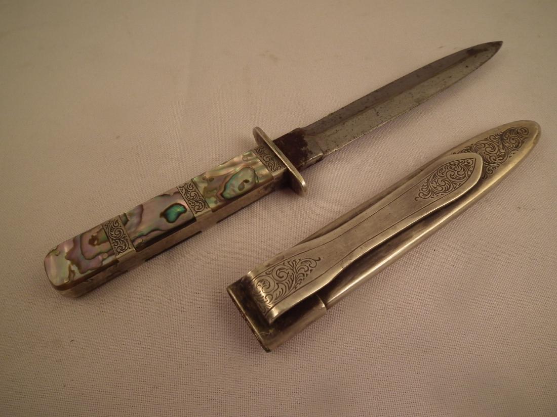 SAN FRANCISCO DIRK: San Francisco type dirk with silver plated engraved sheath and abalone and silver handle. 8.5 inches long, blade 5 inches.