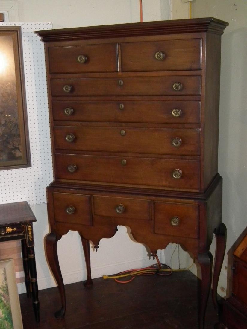 PERIOD MAPLE HIGHBOY: Queen Anne 18th century maple 2 part highboy with fancy shaped skirt and round brass knobs. 71.5 inches high x 39 wide x 19 deep.