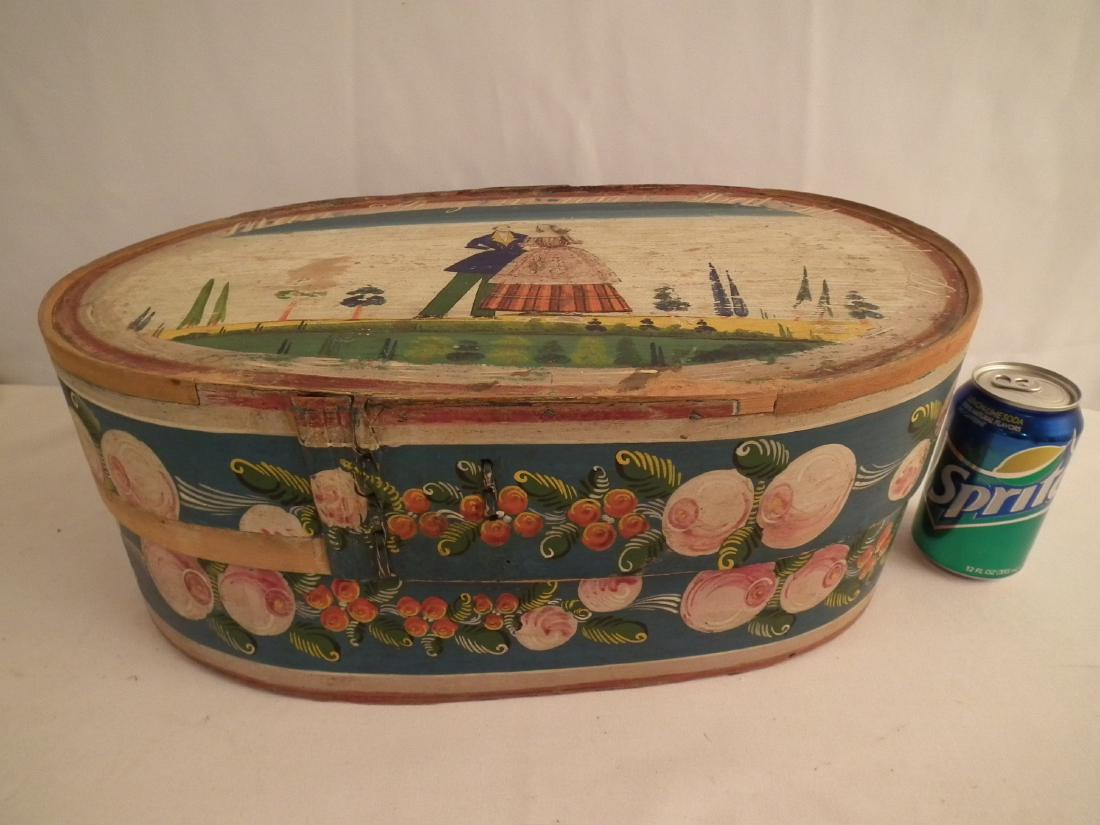 19TH C. WEDDING BOX: 19th century oval bentwood pine continental folk art wedding box with hand painted couple and words MEIN HERZ IN…attributed German. Underside branded FK with letters and numbers. 18 x 11 x 7 inches.