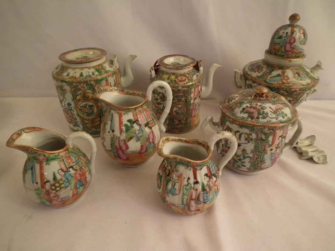 LOT CHINESE TEA WARE: Lot of 7 pieces of Chinese Export Rose Medallion tea ware including: 3 pots (8.5 inch dome cover has broken handle, larger drum teapot has damage); 5 other pieces including creamers (ribbed one repair
