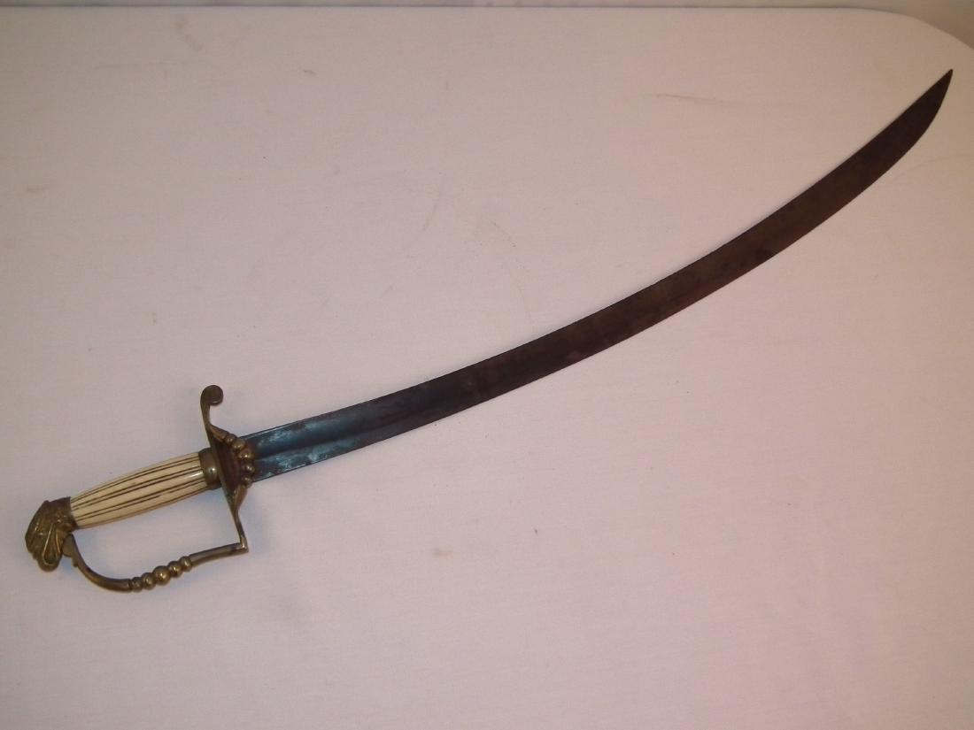 1840 EAGLE POMMEL SWORD: Circa 1840 American military officer's curved blade sword with bone and brass handle, eagle pommel, and gilt engraved blade (rusty/darkened). Size: 33.5 in long, blade 27.75 inches.