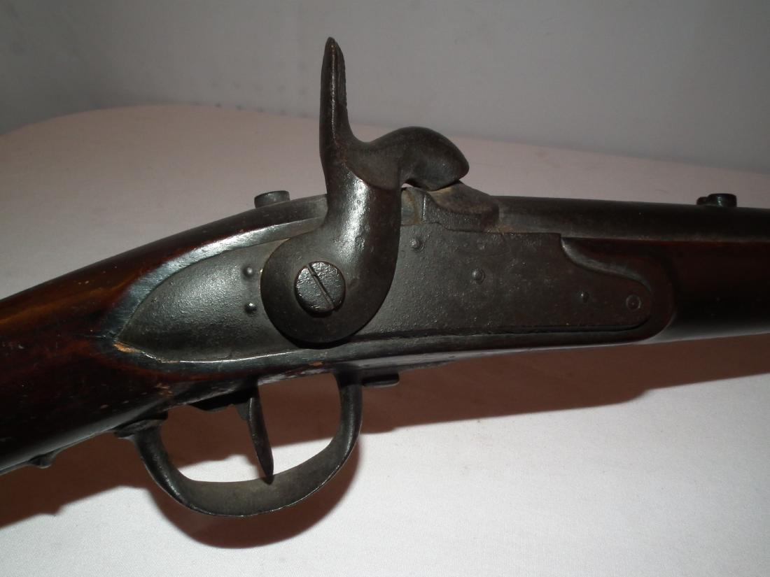 CIVIL WAR MUSKET: Antique American percussion Civil War conversion musket, dated 1815 on barrel, 70 caliber, martially stamped butt AR 185-. Size: 46 inches long, barrel 31.25 inches.