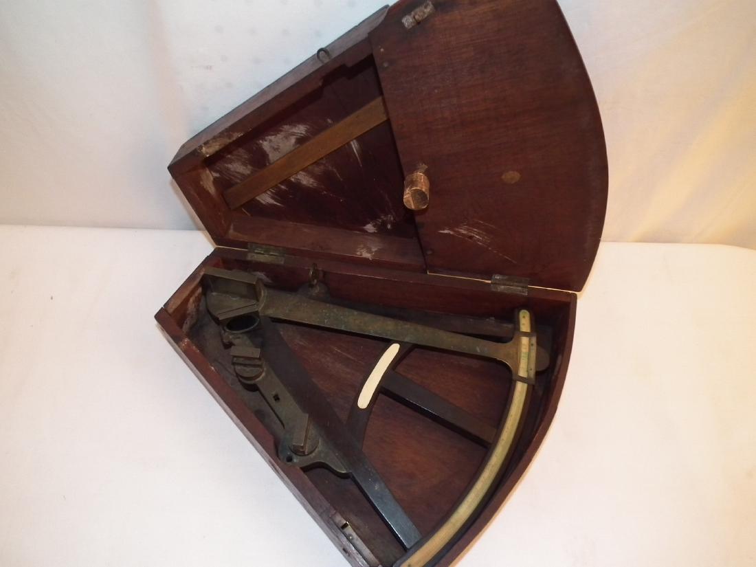 ANTIQUE GILBERT OCTANT: An early English ebony and bone inlaid quadrant in original walnut case. Signed Gilbert and Sons, London. Early 1800's.
