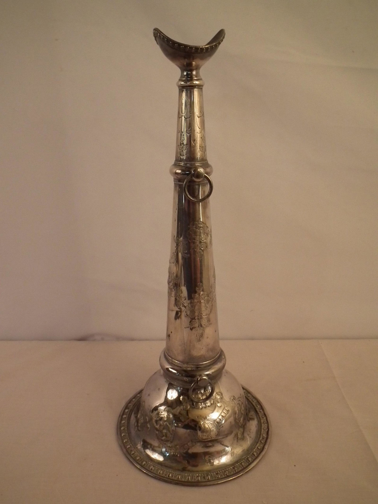 SILVER FIRE TRUMPET: 19th century silver plated presentation fire trumpet with embossed and engraved designs including fire pumper, fire helmet, ladder, implements and floriform designs. Reserve medallion is not engraved.