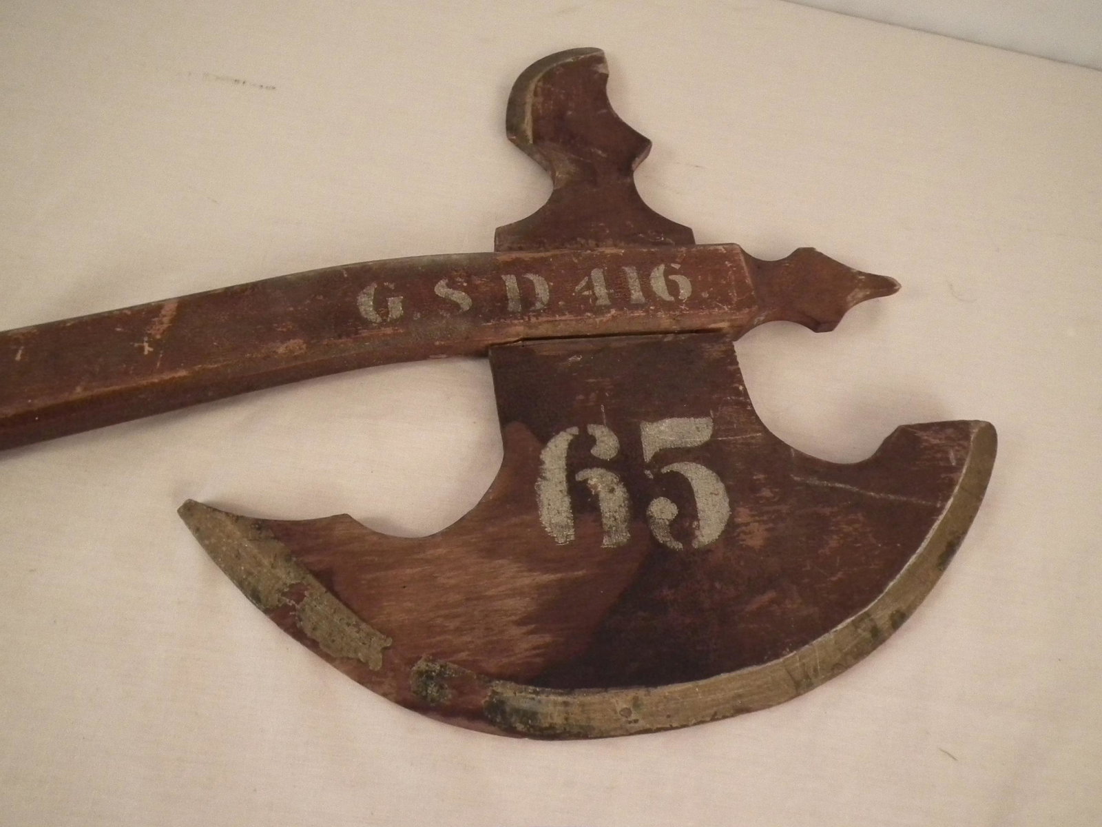 OLD WOOD FIRE AX: Old wooden fire ax sign #65 with painted GSD 416. 41 in long.
