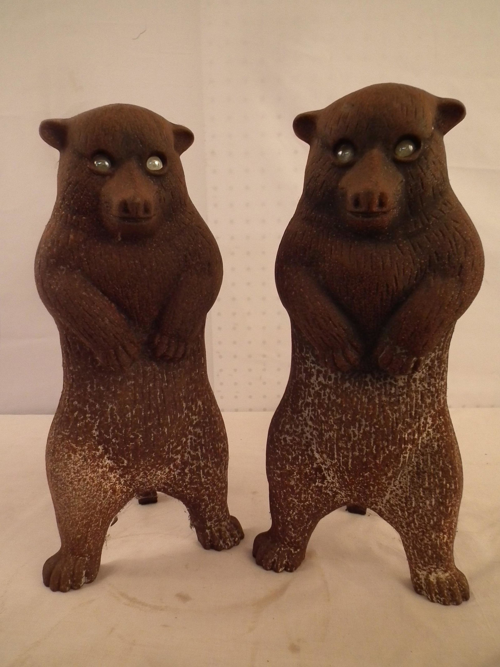 PR. BEAR ANDIRONS: Wonderful, scarce pair of antique iron standing bear andirons with glass eyes. 17 in high x 7 wide.