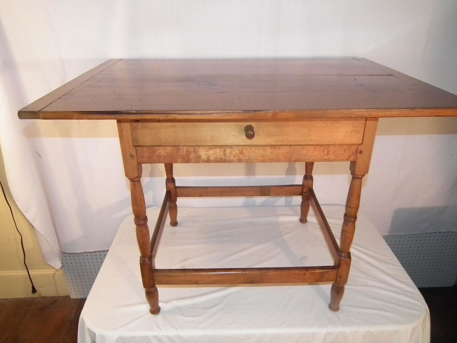 ANTIQUE TAVERN TABLE: Large early 19th century one drawer maple and pine tavern table with bread board ends, 42.5 x 30 x 30 in high.