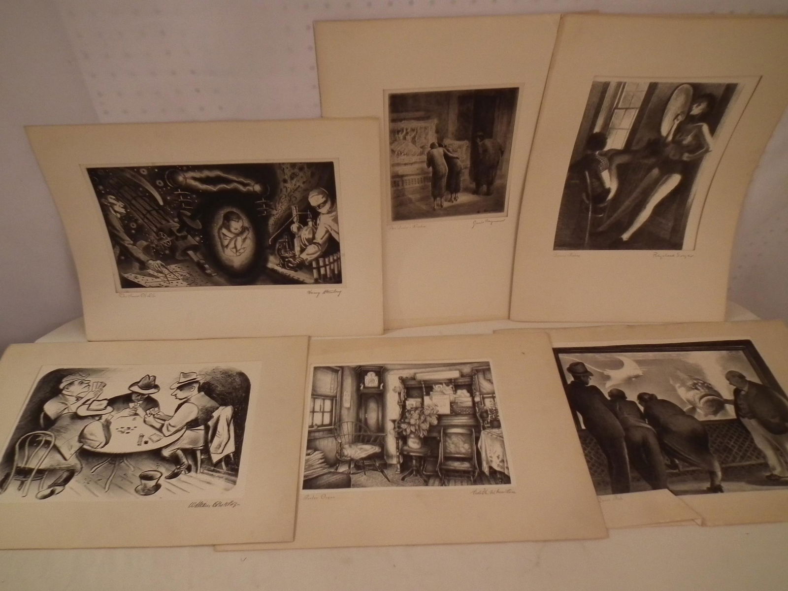 6 AMERICAN PRINTS: Lot of 6 original American prints and etchings by noted American artists, all with American Artist Group label verso, loosely mounted on 13 x 18 inch folio paper: A) Raphael Soyer DANCERS RESTING etch