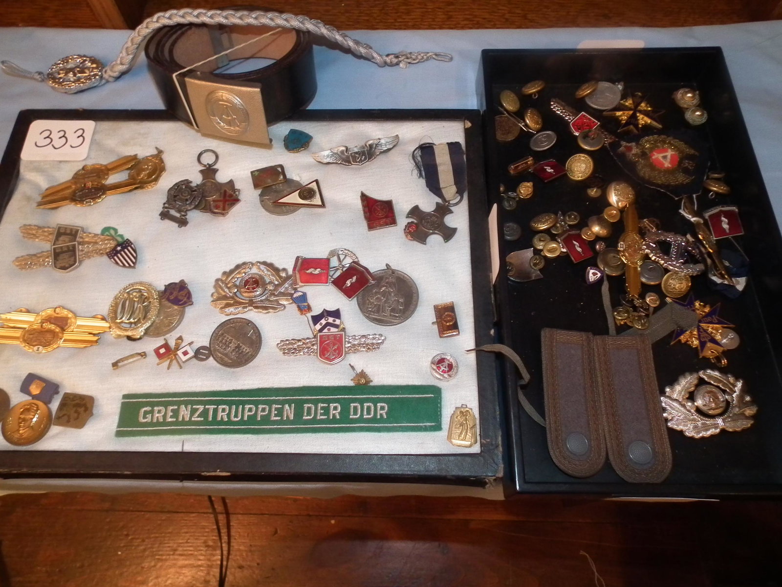E. GERMAN MEDALS ETC: Lot of assorted old East German GST military medals and pins, Grenztruppen DDR ribbon and more.