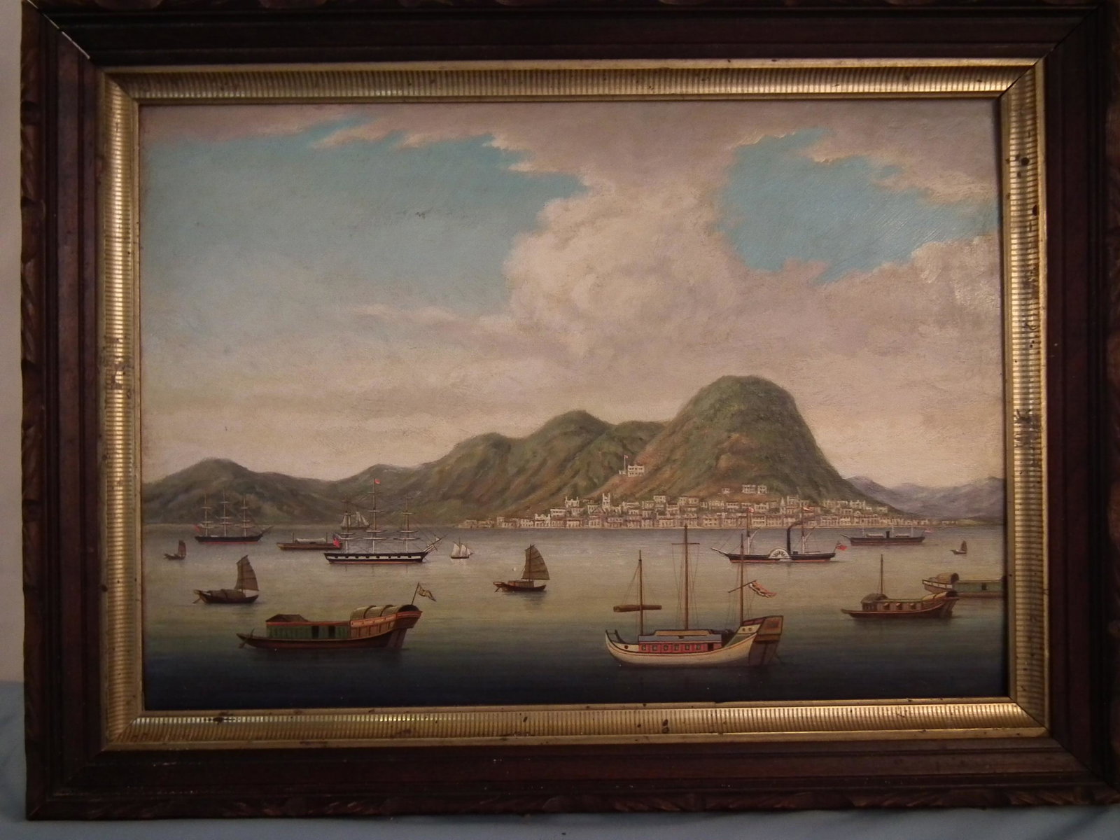 ANTIQUE CHINA TRADE PAINTING: Antique China Trade oil painting on wood panel with American and British ships in Hong Kong harbor. Unsigned. Stamped into wood verso is DR. CAMPBELL 1931. 14 x 20, framed 18 x 24 inches.