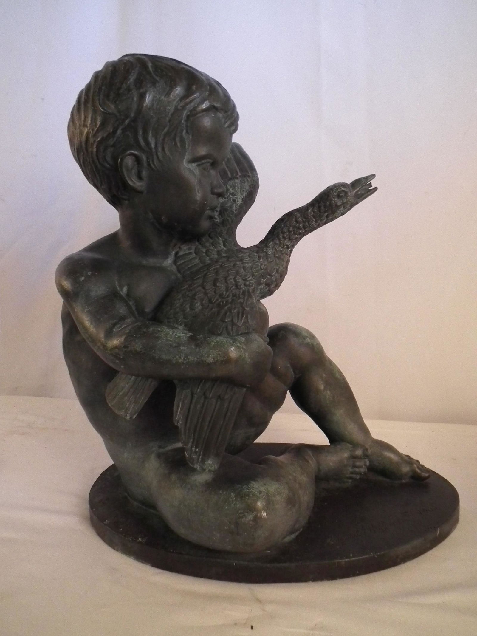 BRONZE FOUNTAIN SGD. HOFFMAN: Old verdigris bronze fountain of a nude boy holding a goose signed Edward F. Hoffman III 1963. Comes with lead 6" base. Bronze is 20 in high x 17 wide. (American sculptor 1916-1991)
