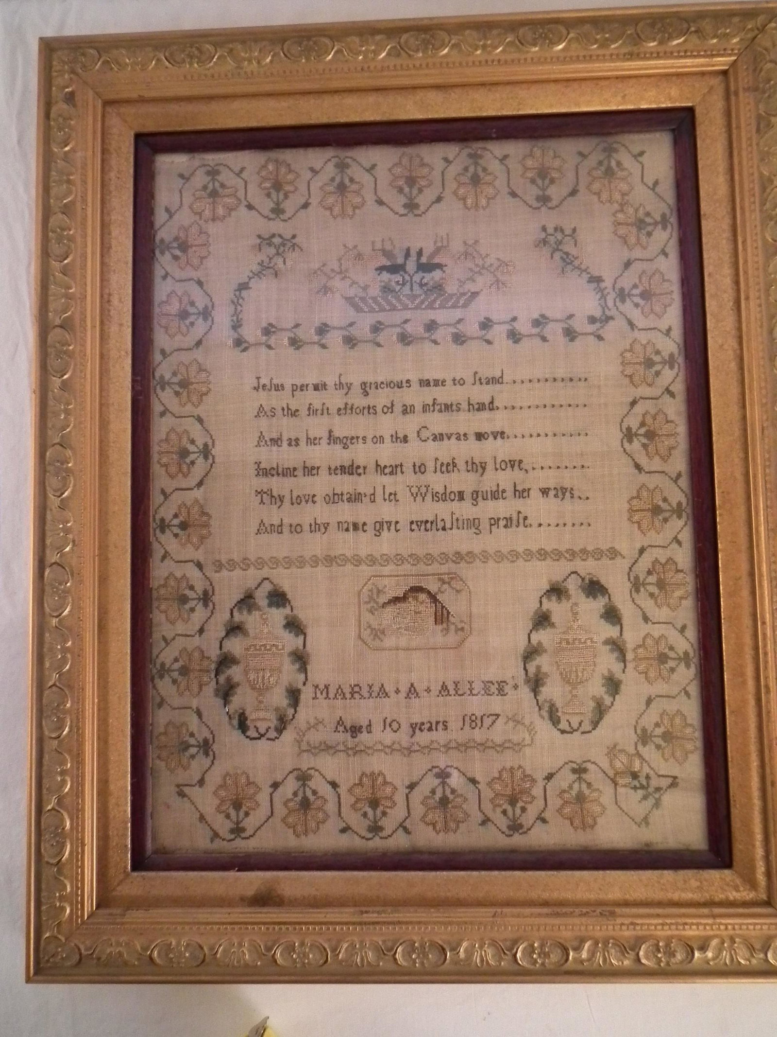 1817 NEEDLEPOINT SAMPLER: Early needlepoint sampler dated 1817 by Maria A. Allee, Aged 10 years. Has a christian poem with flowers, urns, etc. 16.5 x 12.5 inches, framed 22 x 18. VG condition, no stains or tears.