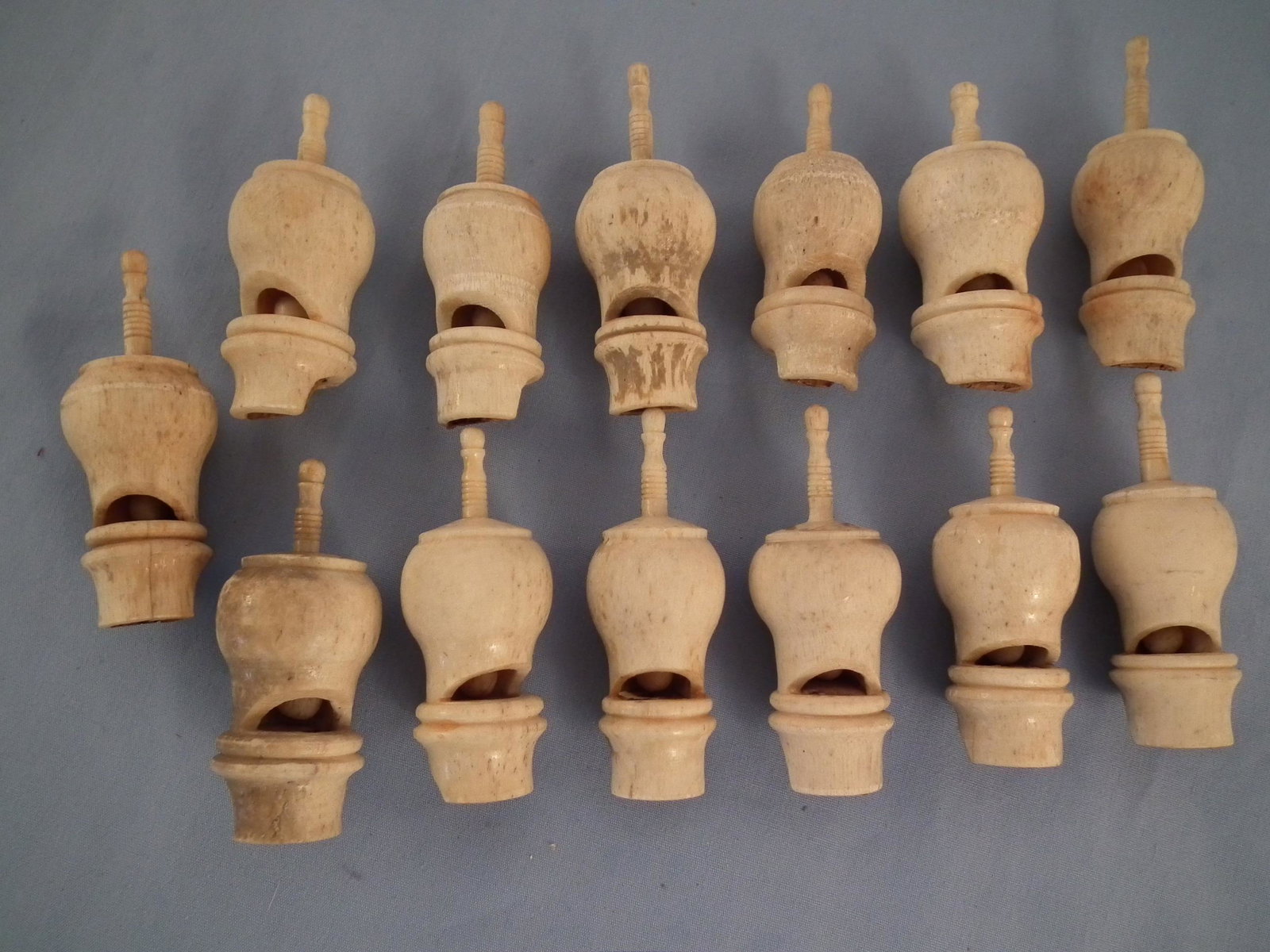 13 WHALE BONE WHISTLES: Lot of 13 sailor made whale bone whistles, 19th century, 2.5 inches long.