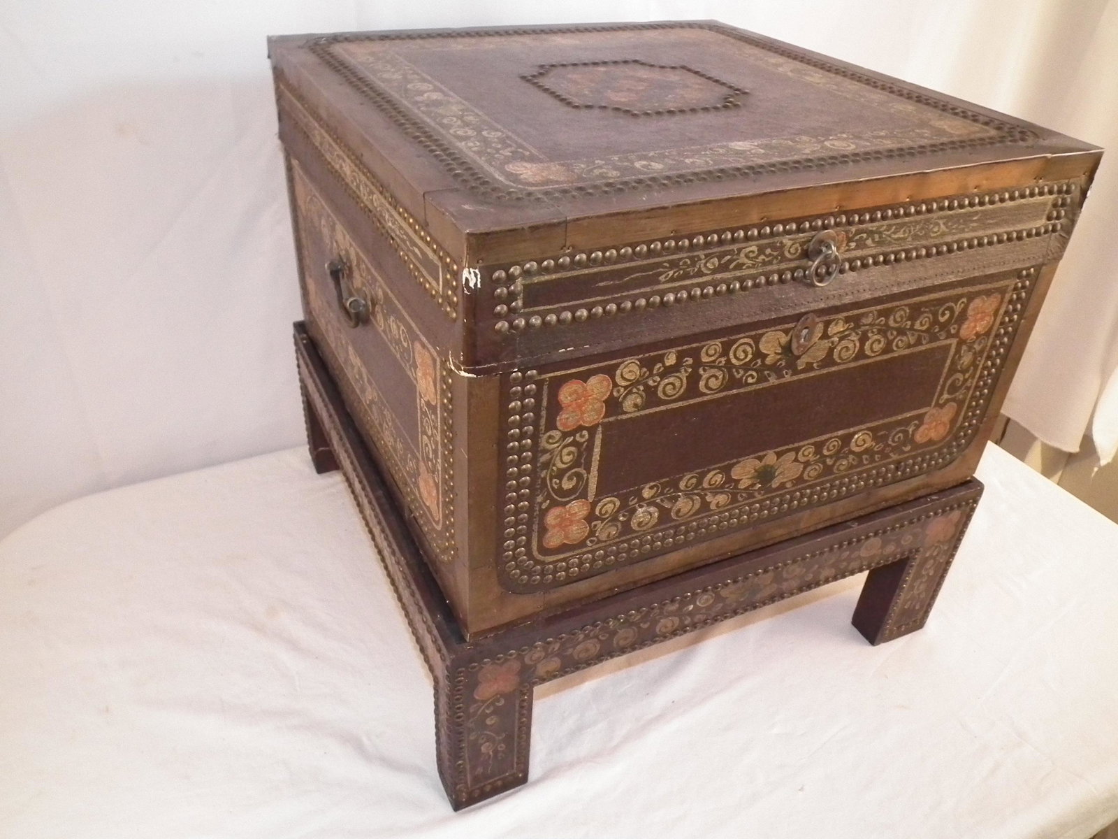 CHINA TRADE PIGSKIN TRUNK: Vintage square China Trade pigskin covered and decorated trunk on stand. 20" square and 20" high.