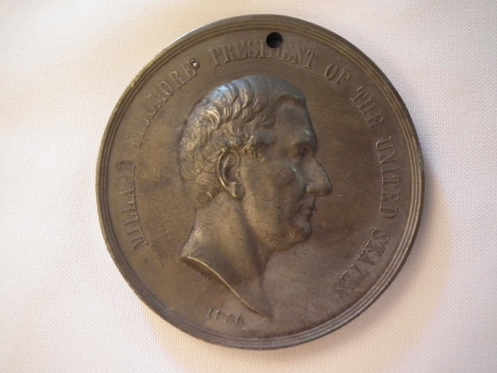 FILLMORE PEACE MEDAL 1850: Large Millard Fillmore presidential peace medal with Indian and soldier verso LABOR, VIRTUE, HONOR. Has engraver name S. Ellis 1850 under bust. Size: 3" or 75mm and weighs 219.2 grams.