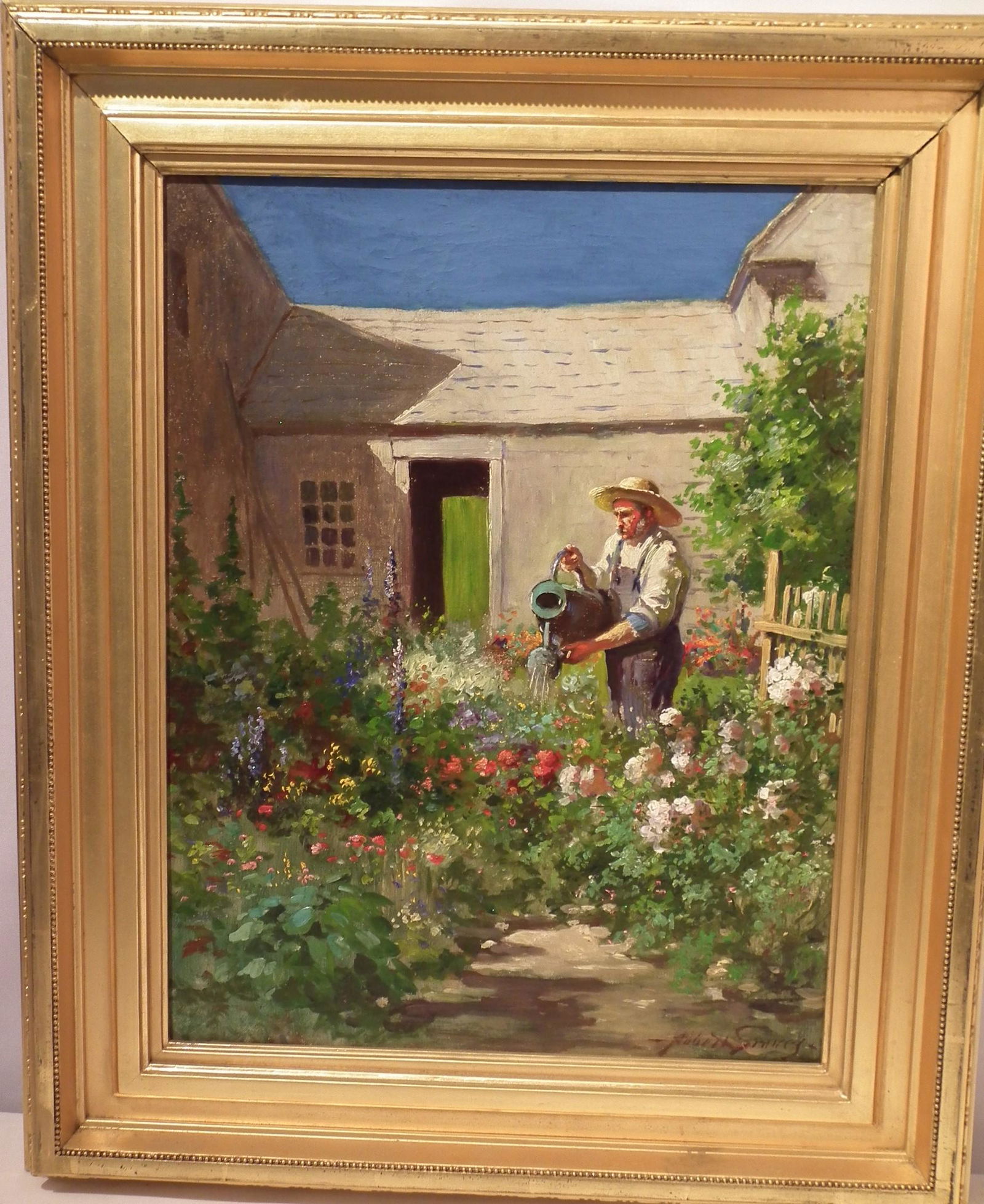 ABBOT FULLER GRAVES OIL PAINTING: Fine oil on canvas depicting a farmer watering colorful flowers outside a barn, signed Abbott Graves. 18 x 14, framed 24 x 20 inches. (Abbott Fuller Graves 1859-1936 was a Mass. and Maine painter know